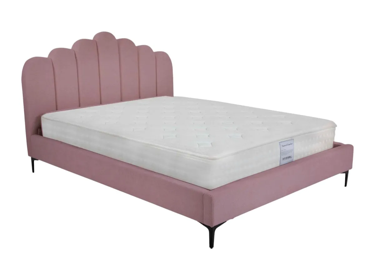 A pink bedframe with scalloped headboard from EZ Livings Fay range. Angled view.