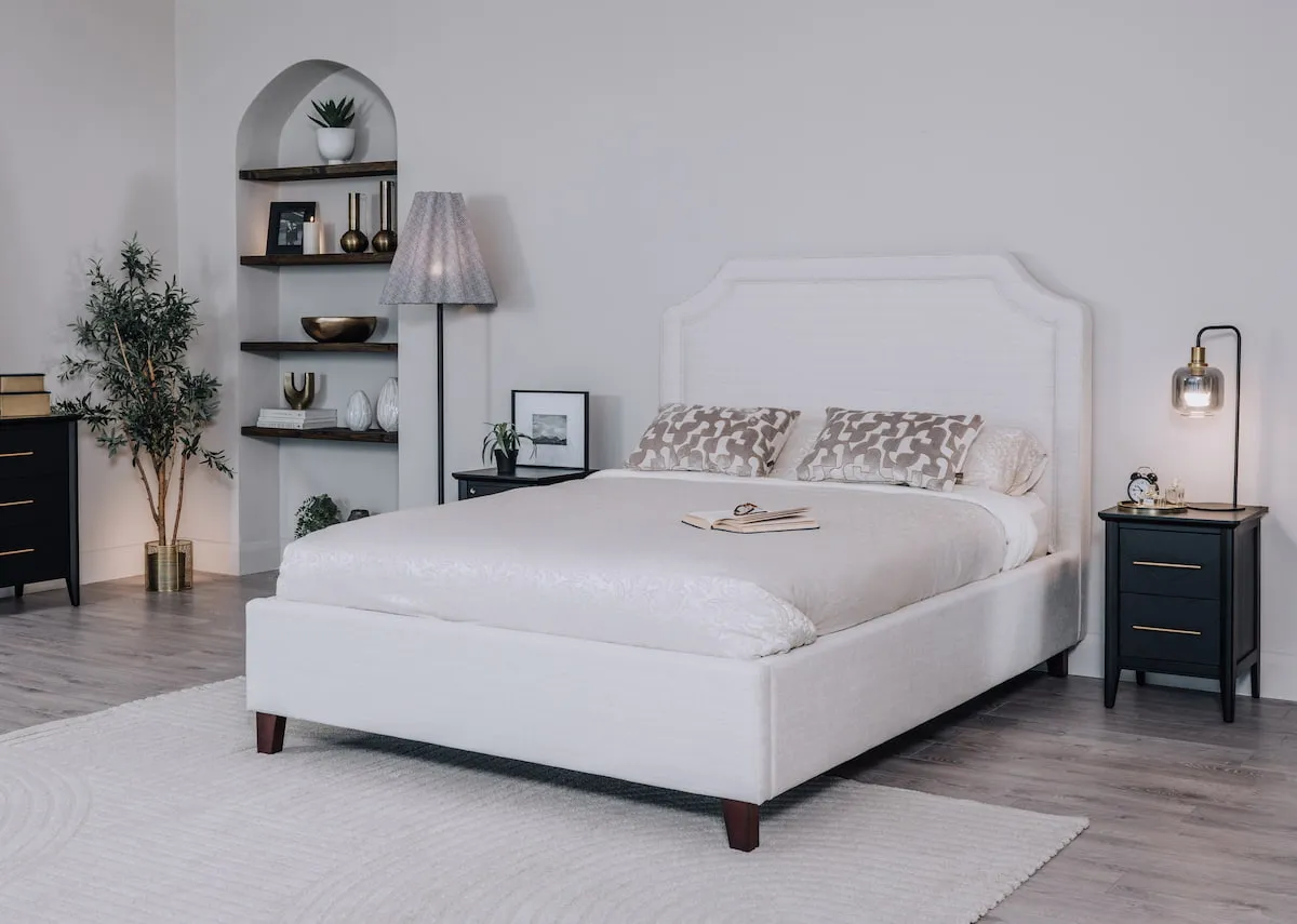 A lifestyle image of the Archie Bedframe with chevron locker and Rodrigo floor lamp.