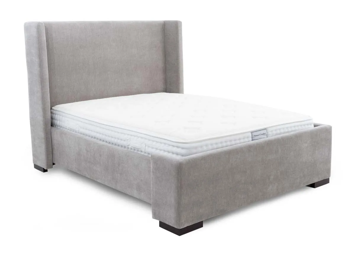 A grey fabric bed frame with high winged headboard from EZ Livings Quay west range.