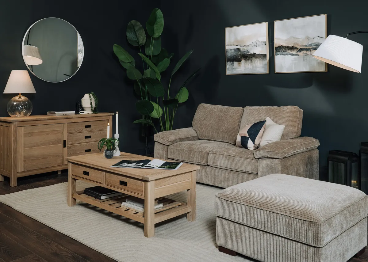 A lifestyle image of the Westport sofa with ottoman with Albany sideboard and coffee table with Elling mirror.