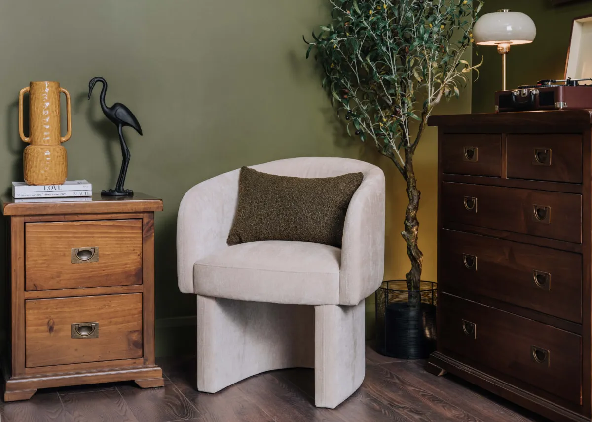 A lifestyle image of the Hope sand chair with the Aisling chest and locker