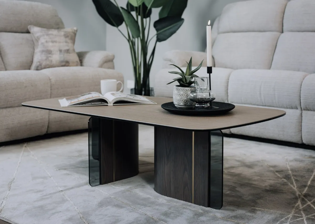 A lifestyle image of the Blanco coffee table with plate and candles