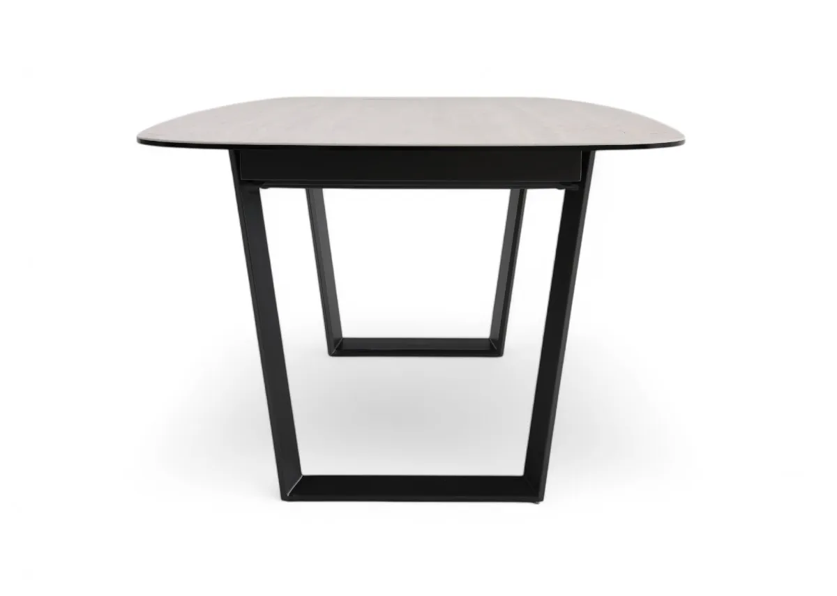 A ceramic top and metal frame dining table from EZ Livings Tempo Range. Side view