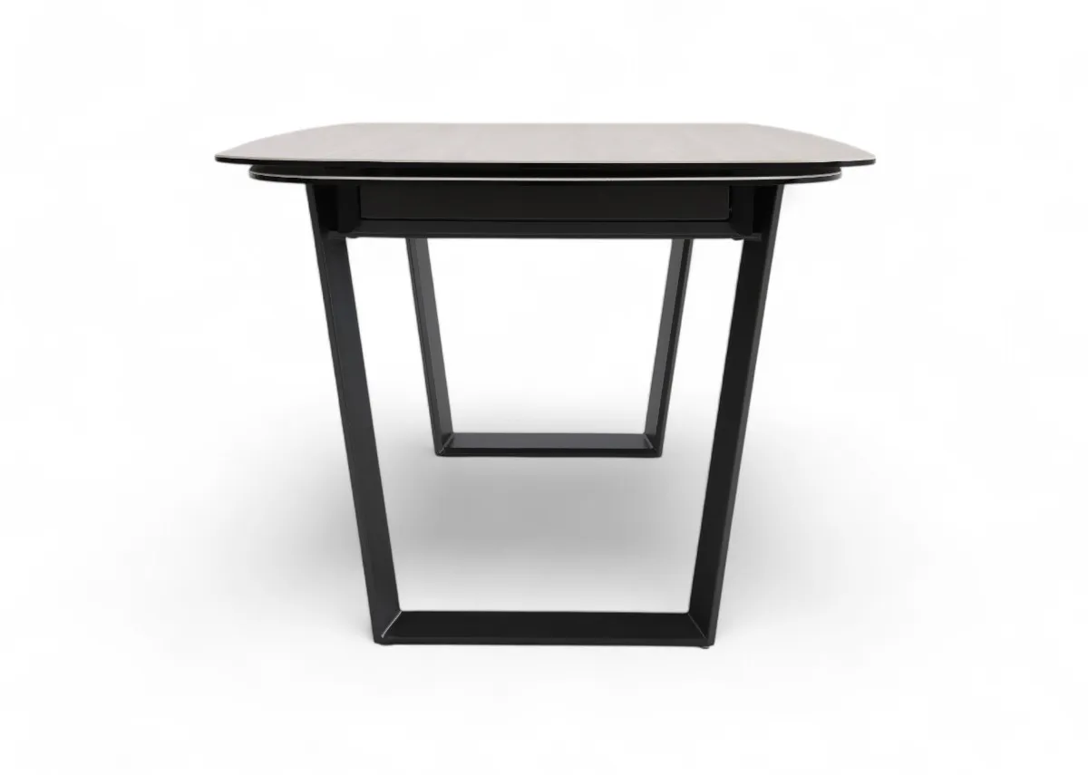 A ceramic top and metal frame dining table from EZ Livings Tempo Range. Side view of table extended.