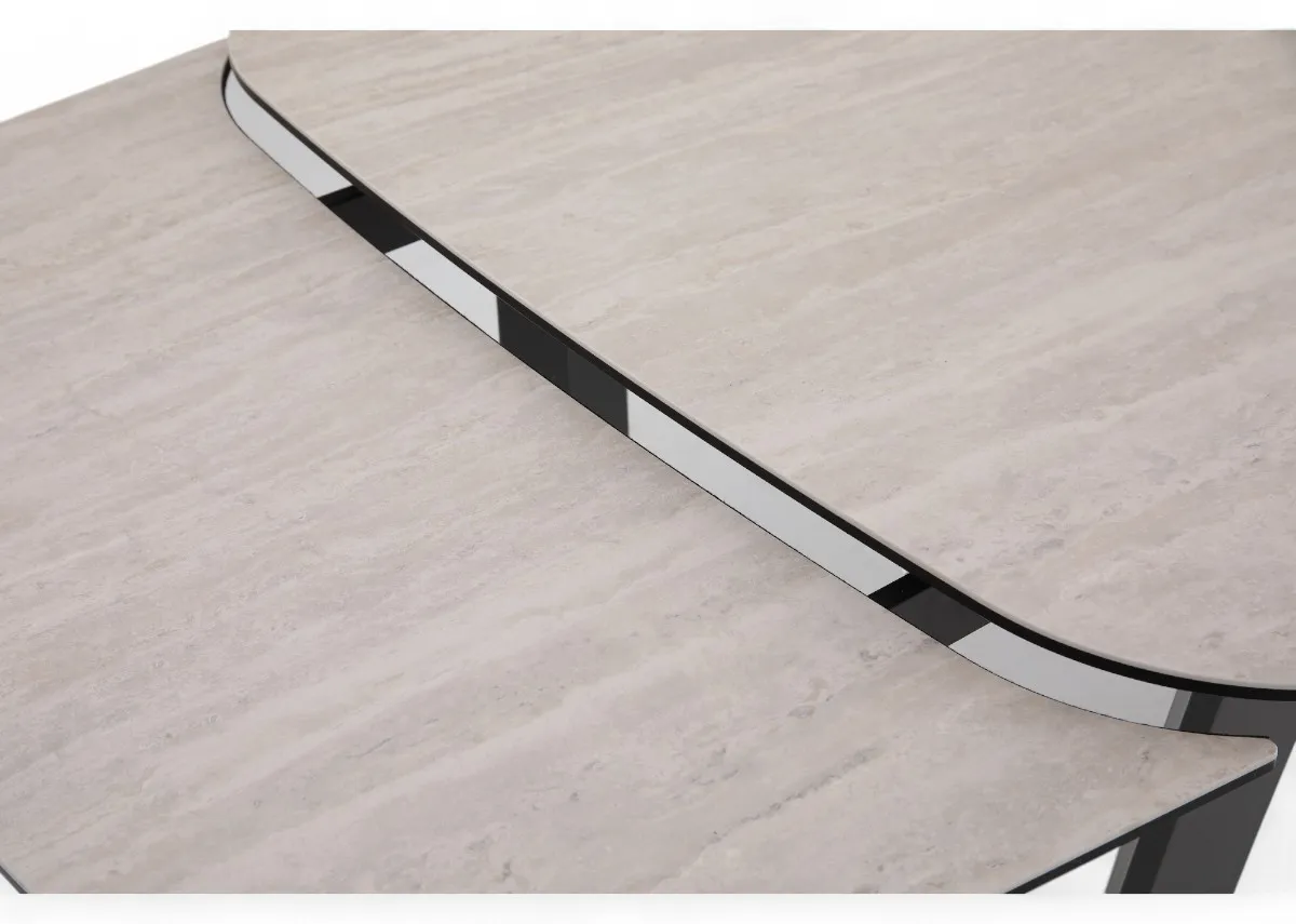 A ceramic top and metal frame dining table from EZ Livings Tempo Range. Closeup of extension leaf