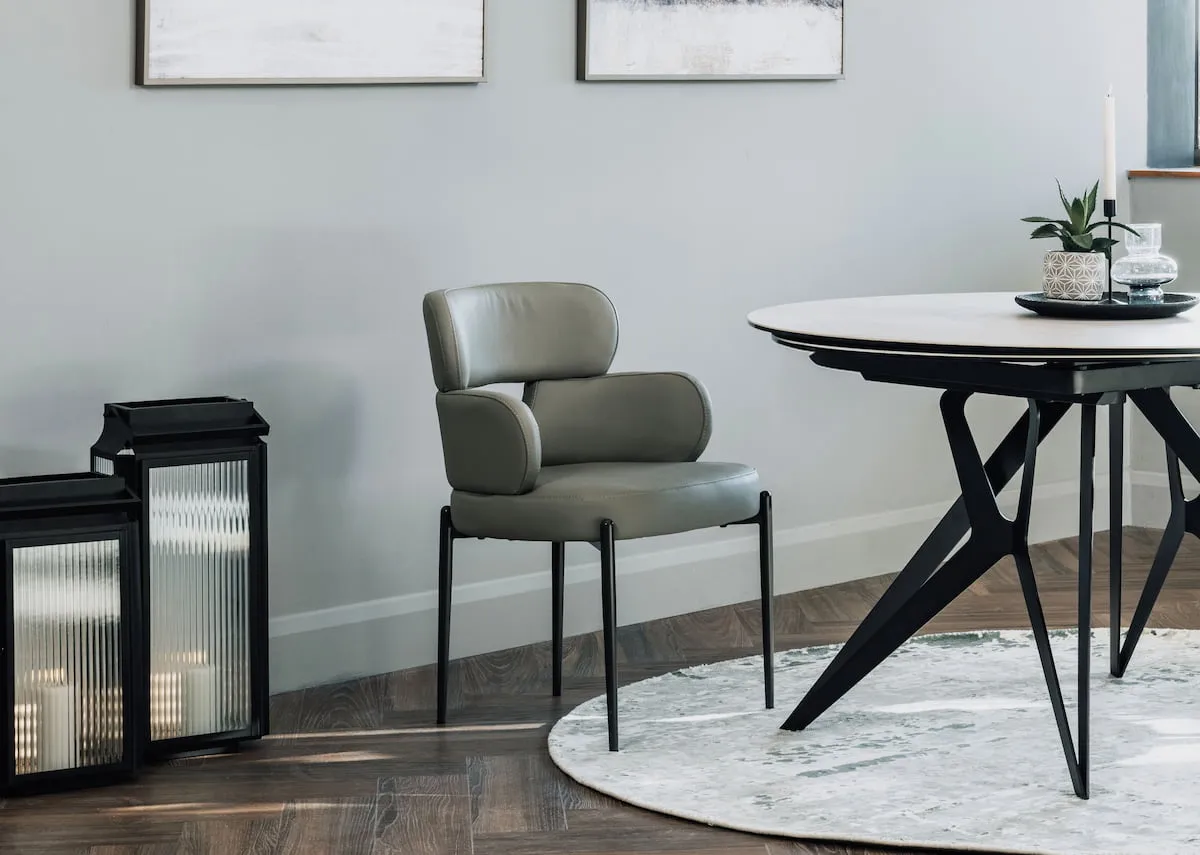 A lifestyle image of the Fusion grey chair with dining table