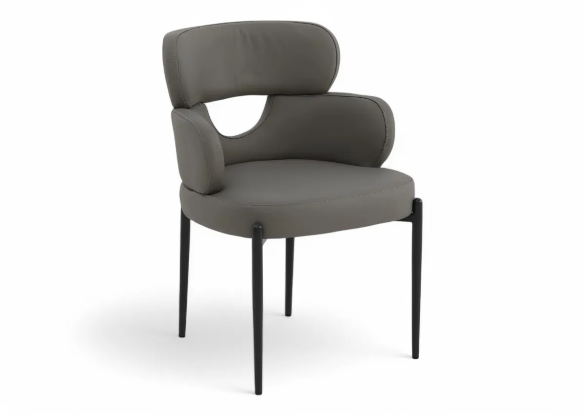 A grey leather dining chair with metal legs from EZ Livings Fusion range. Angled view of curved back with gap