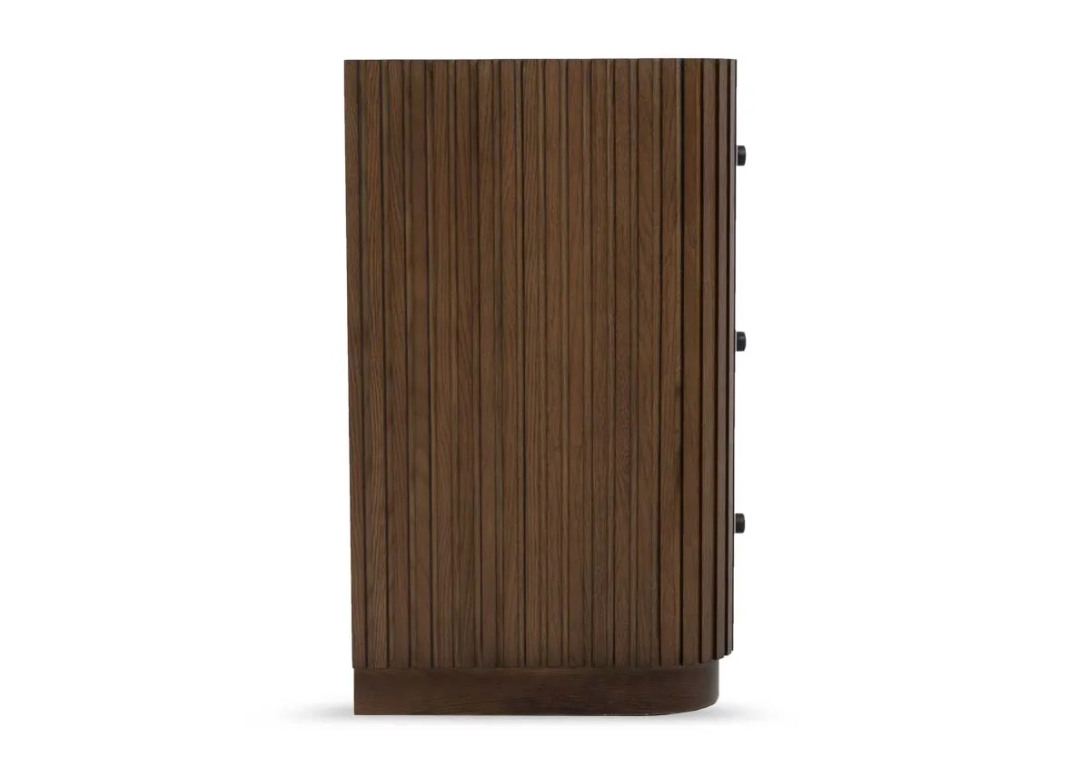 A 3 drawer dark brown chest of drawers from EZ Livings Jacob range. Side view of curved edges