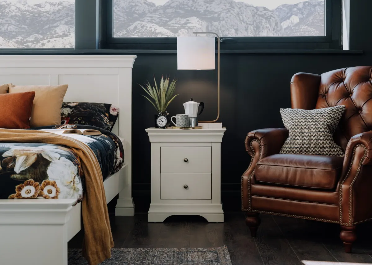 A lifestyle image of thge Dove locker with matching bedframe and Adare armchair