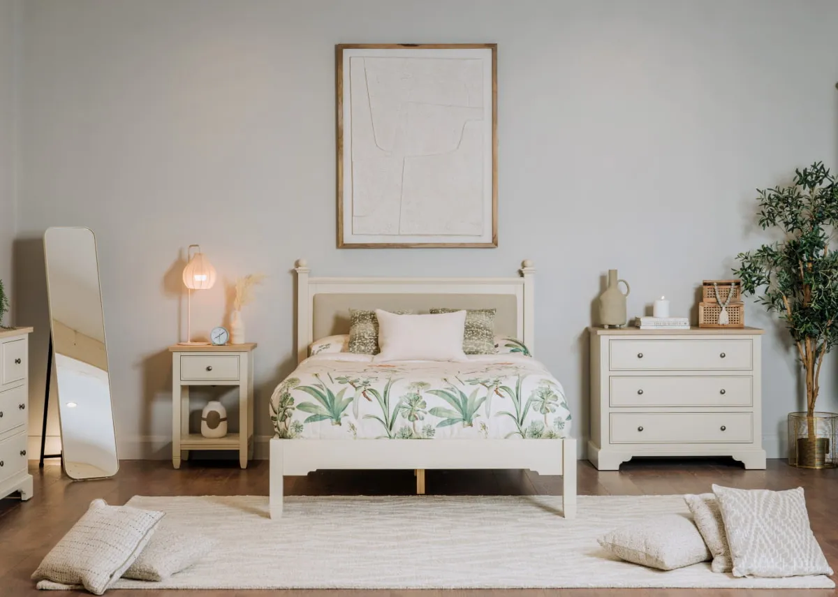 A lifestyle image of the Dawn  Bedframe with chest and locker with Rilla table lamp.