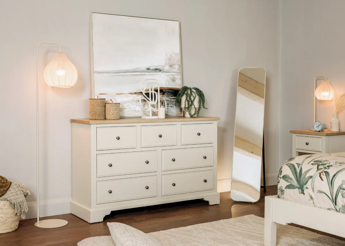 A lifestyle image of the Dawn Chest with Fern & Taina mirrors with Rilla floor lamp