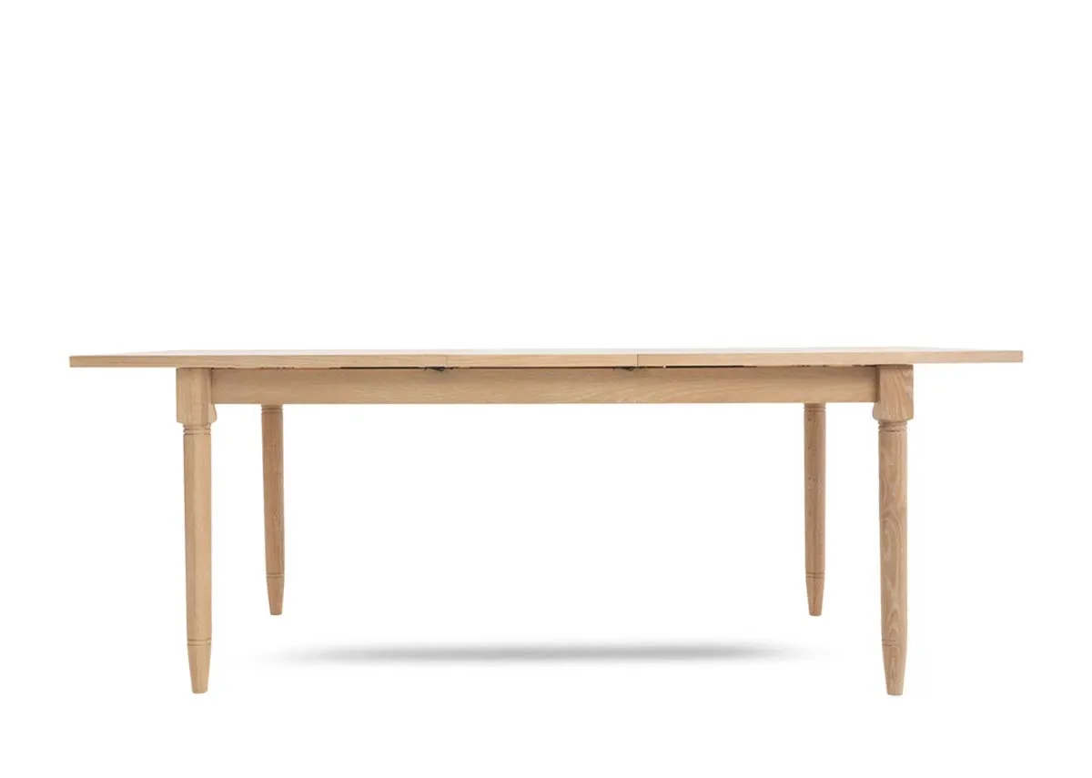 A rectangular oak dining table from EZ Livings Dawn range. Front view of extended table.