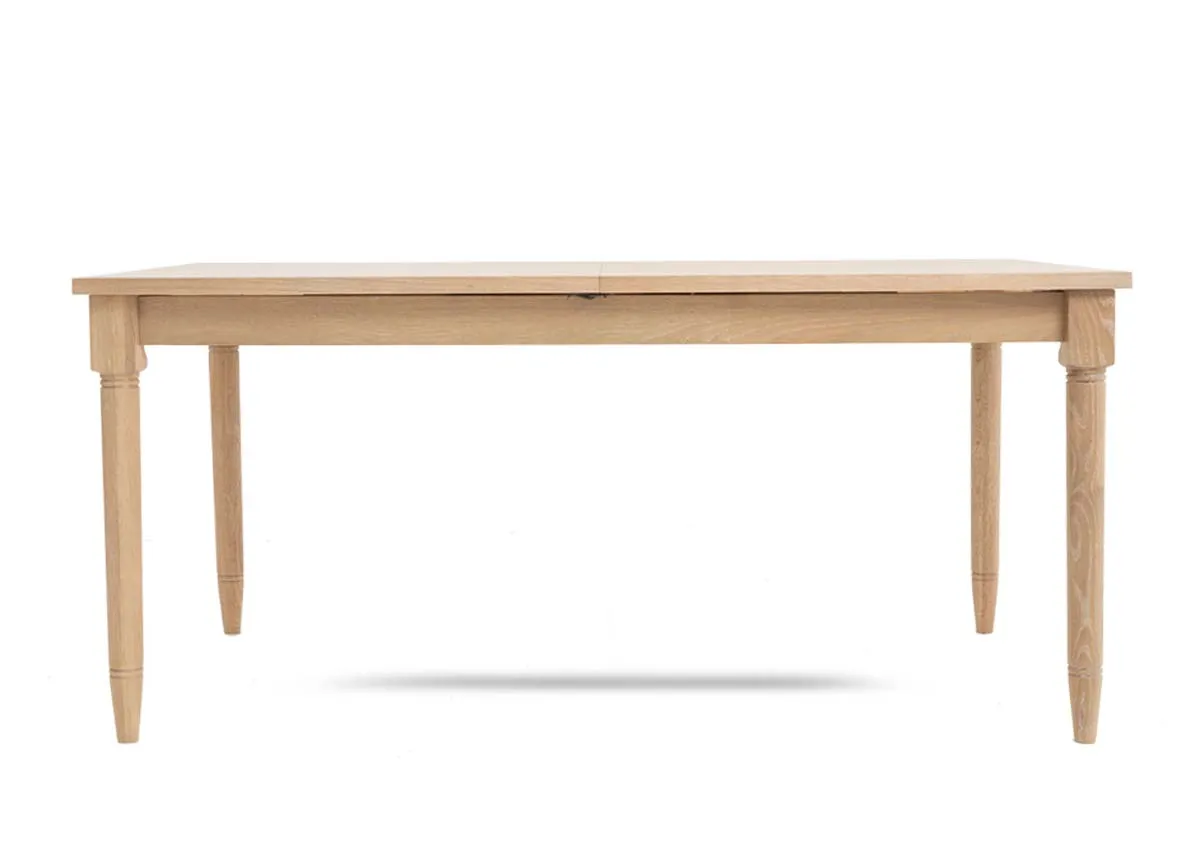 A rectangular oak dining table from EZ Livings Dawn range. Front view of table fixes with tapered legs