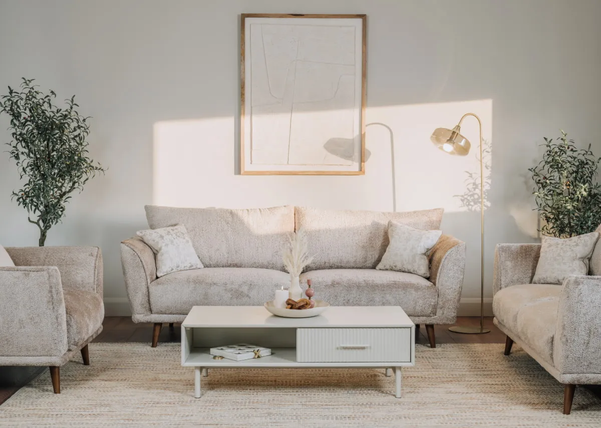 A lifestyle image of the Boutique sofa range with the Palma living tables and Isparta canvas
