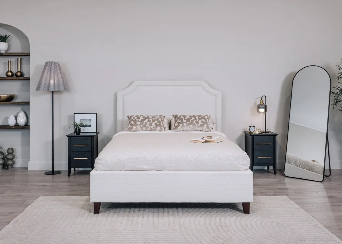 A lifestyle image of the Vance mirror with the Archie bedframe