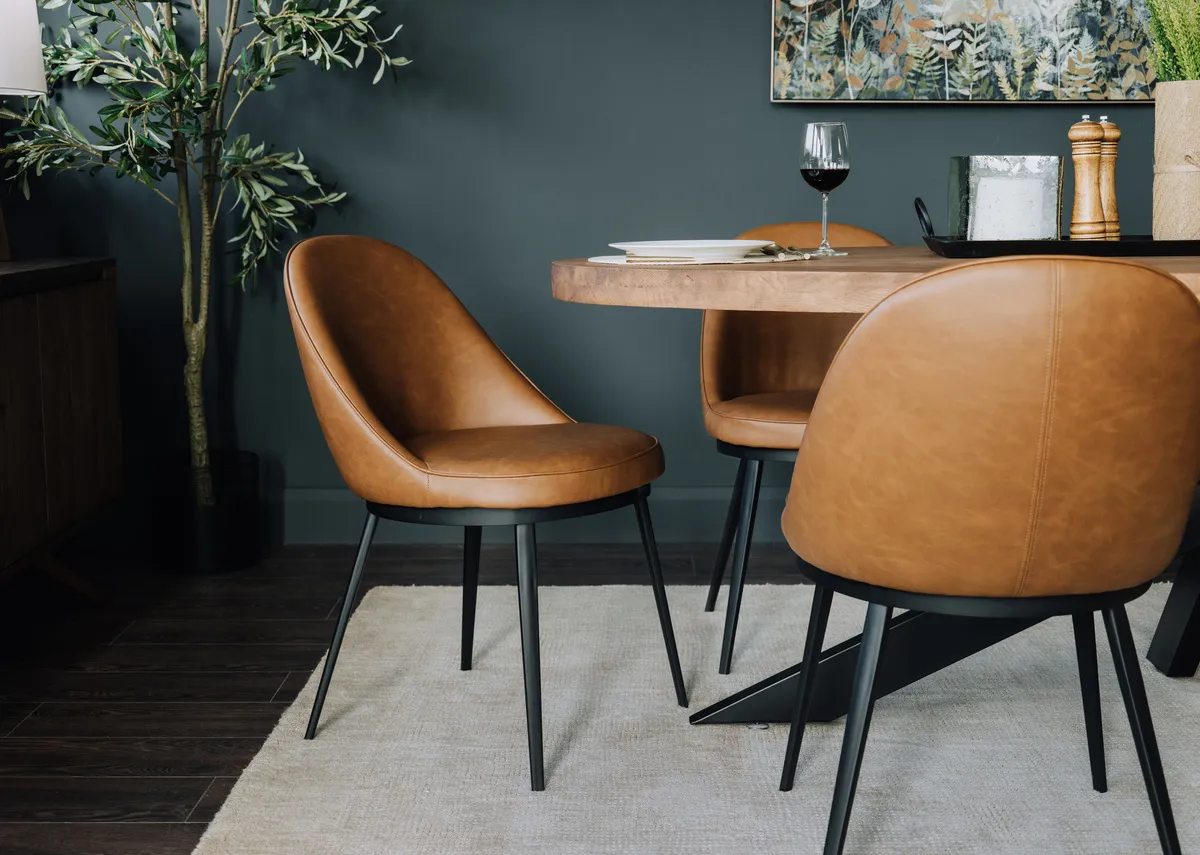 A lifestyle image of the Gain dining chair with Oslo table.