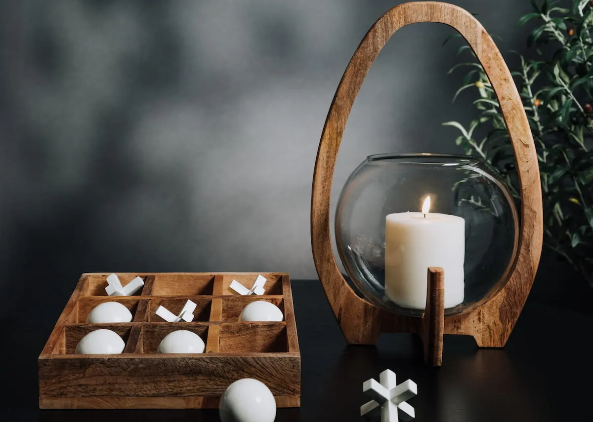A lifestyle image of the Kimora candle holder with LED candle and tic tac toe white box set.