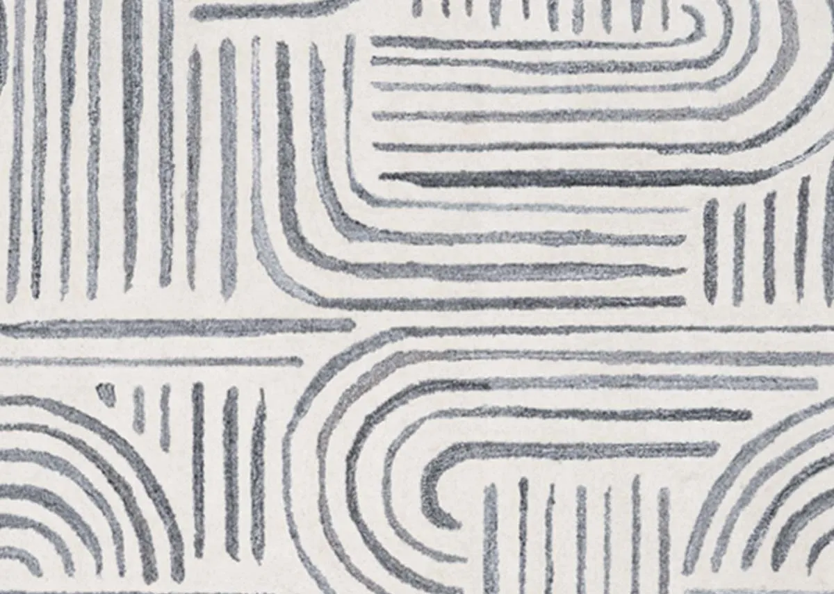 A grey ivory geometric design rug from EZ Livings Orlando range. Closeup of swirly design