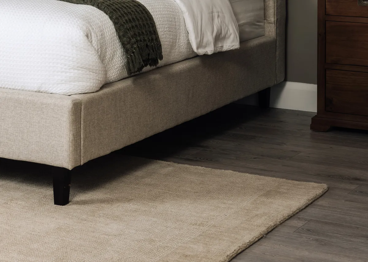 A lifetsyle image of the Chelsea bedframe with Charleston rug.