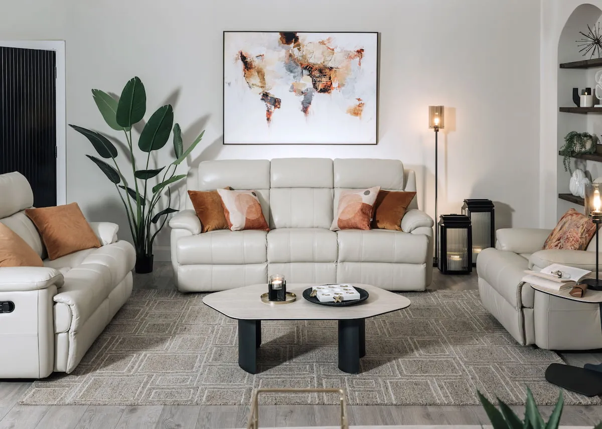 A lifestyle image of the Embrace white reclining sofa range with Temp coffee & sofa table with Memphis rug.
