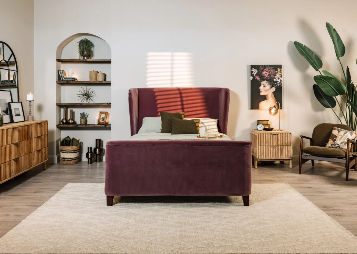 A lifestyle image of the Kansas rug with the Maison purple bed and Lily print.
