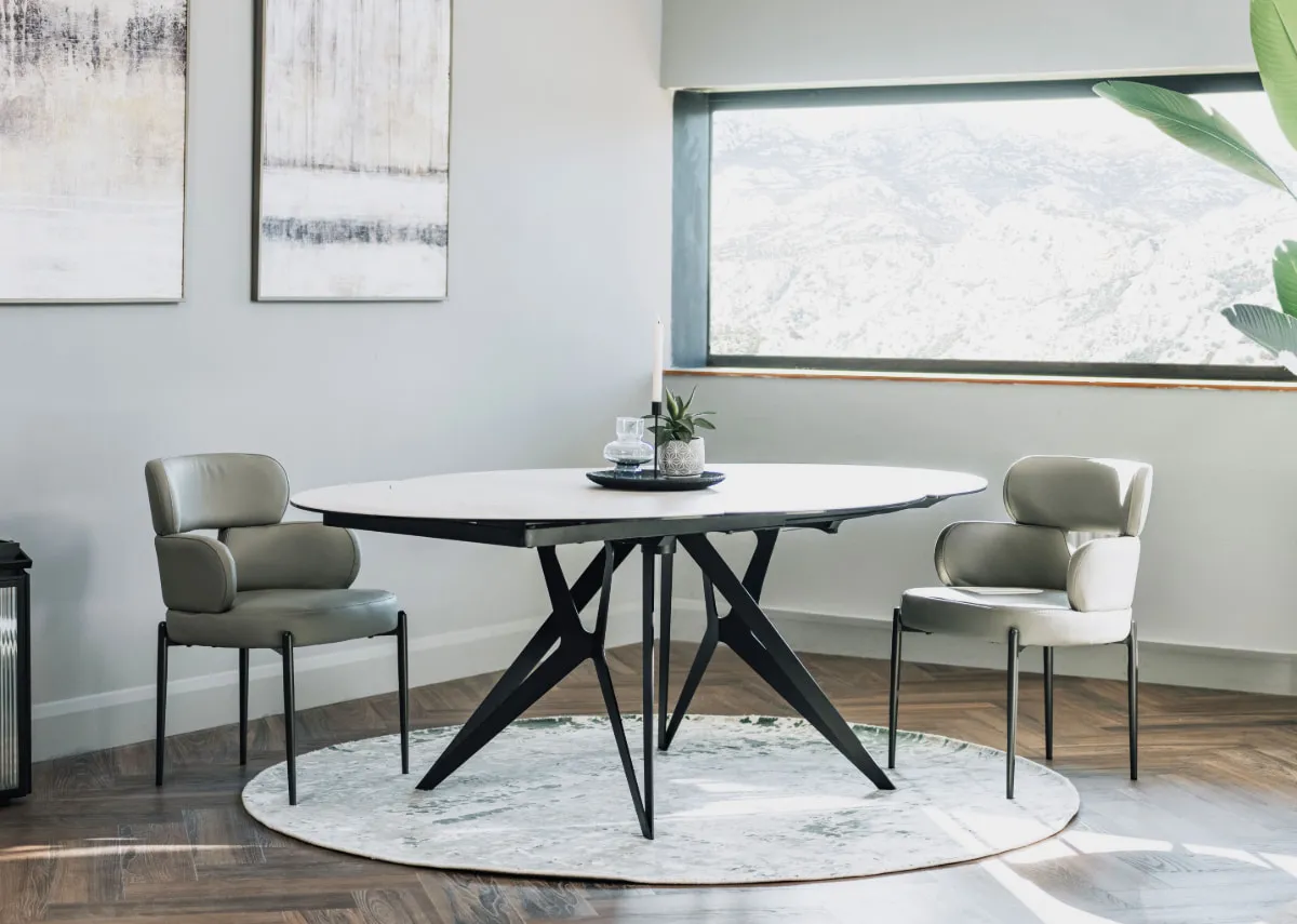 A lifestyle image of the Fusion dining table with the Lorenzo dining chairs in a small kitchen setting.