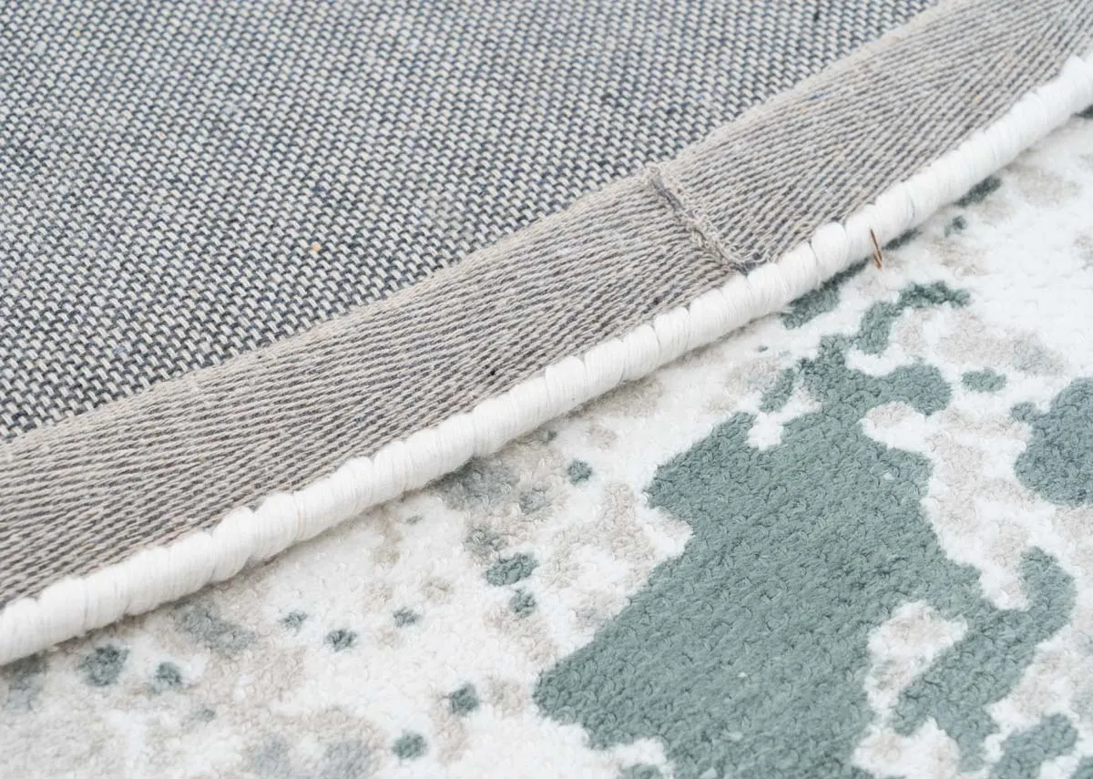 A round green and ivory rug from EZ Livings Modesto range.Closeup of underlay