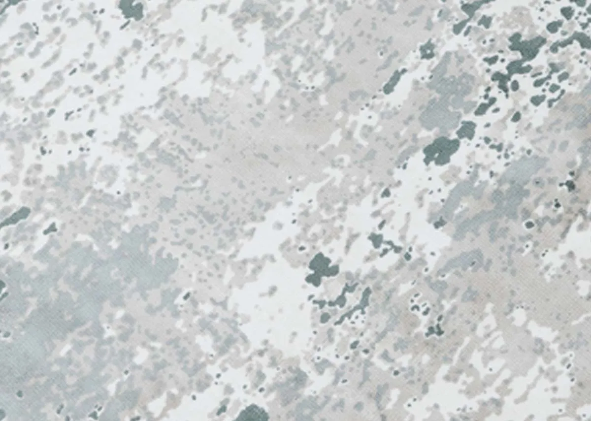 A round green and ivory rug from EZ Livings Modesto range.Closeup of distressed pattern