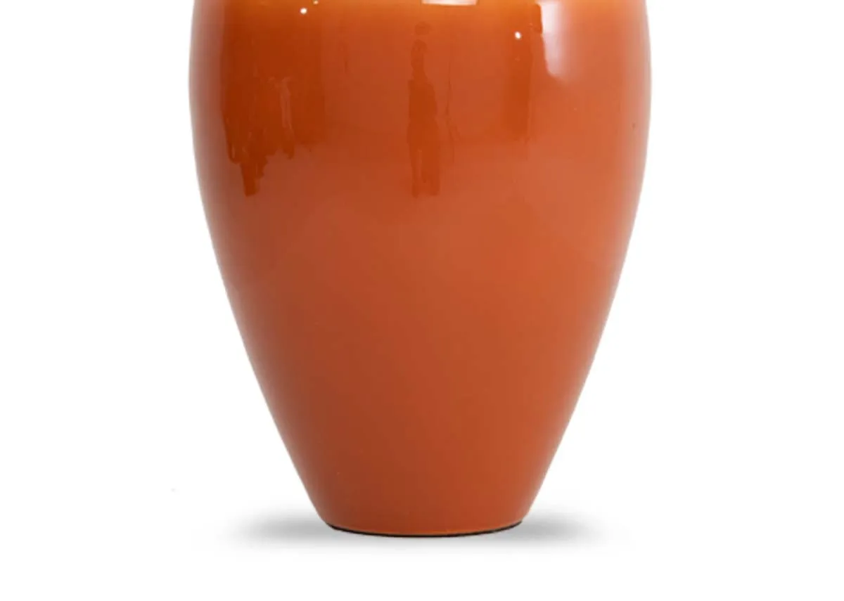 A small vase with orange base and cream top from EZ Livings Velho range. Closeup of orange base