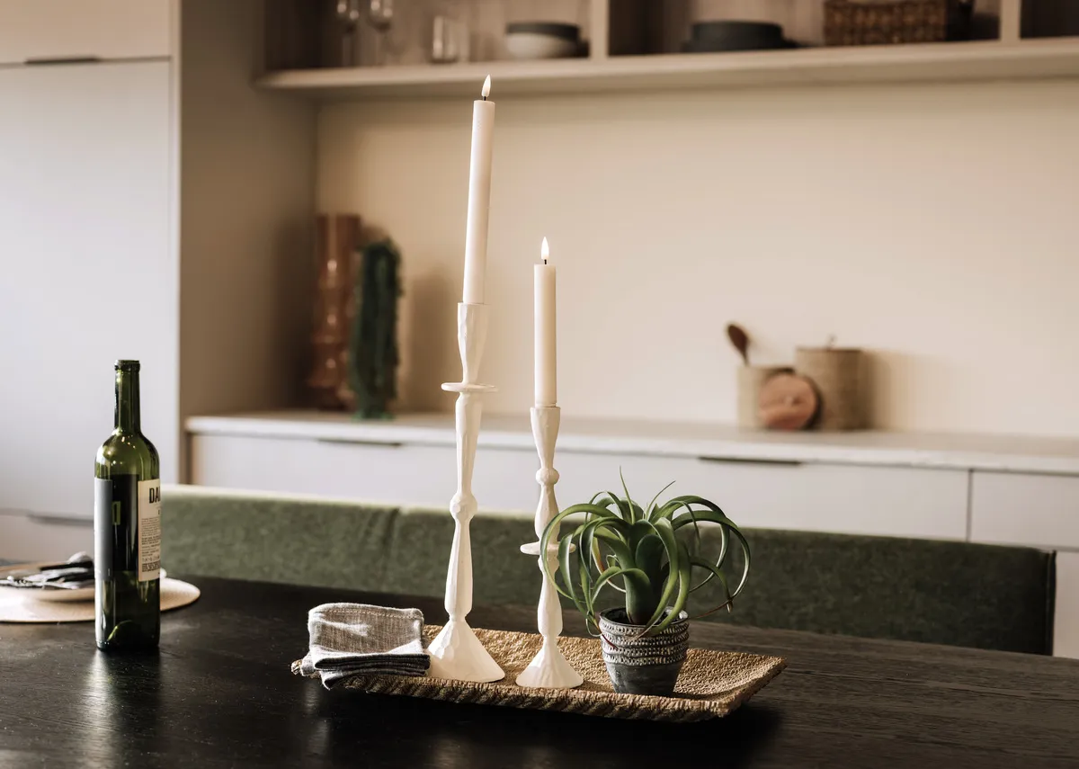 A lifestyle image of the Casandra candle holders on a tray in a kitchen setting.