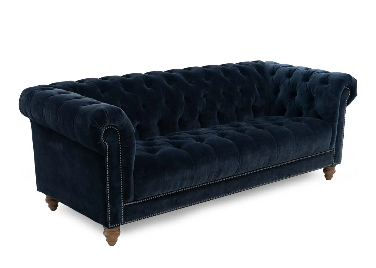 A 3.5 seater roll back sofa from EZ Livings Adare range. Angled view of tufted button detail on back and seat cushions.