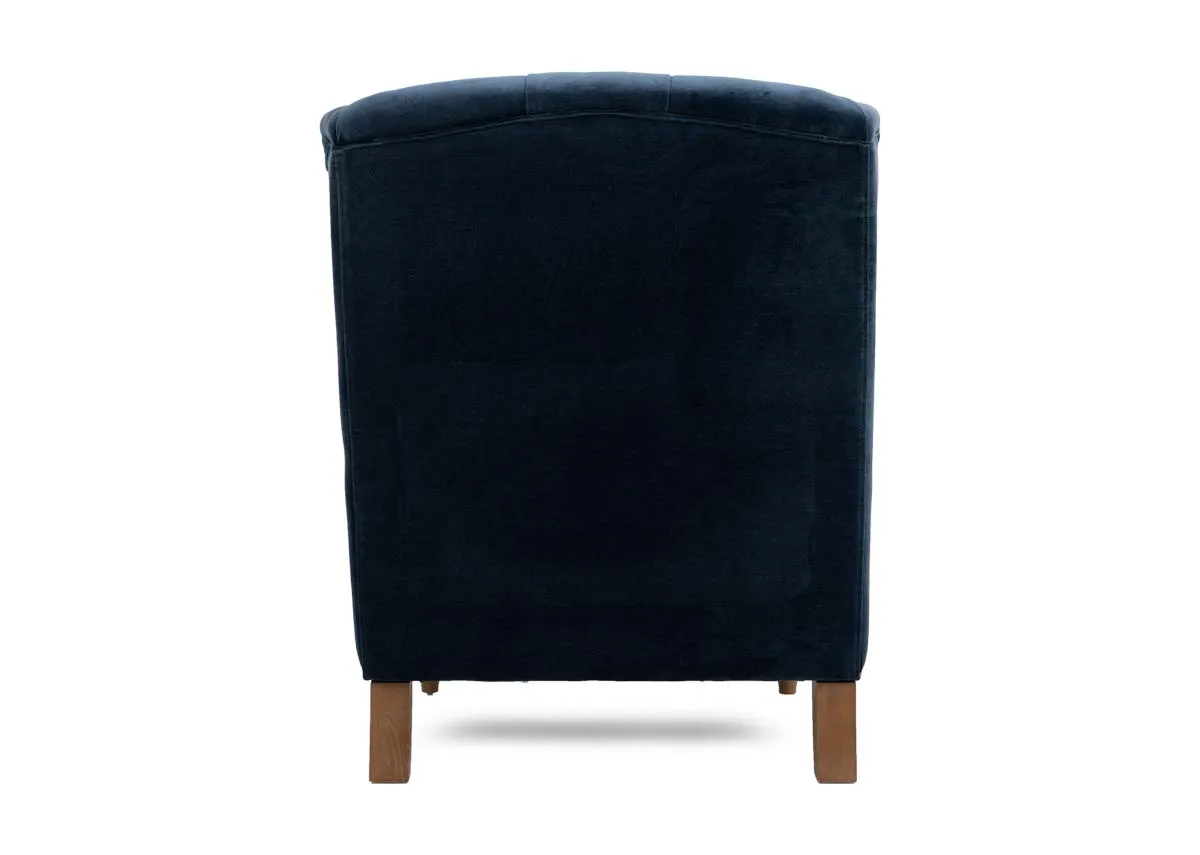 A blue fabric wing chair with stud detail from EZ Livings Adare range. Back view of wide upholstered back