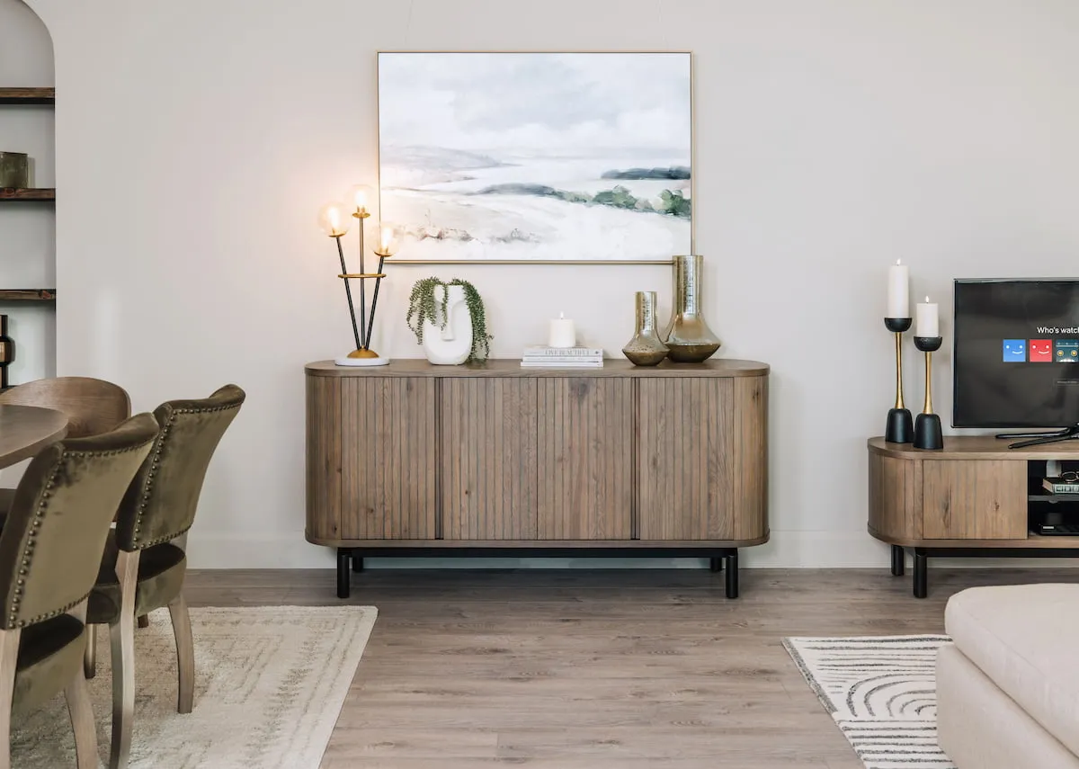 A wide grey oak sideboard with panel finish from EZ Livings Vega range. Front view of doors open showing shelving space