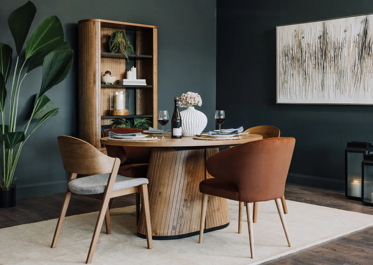 A lifestyle image of the Vega rustic oak table with Vega and Victor dining chairs