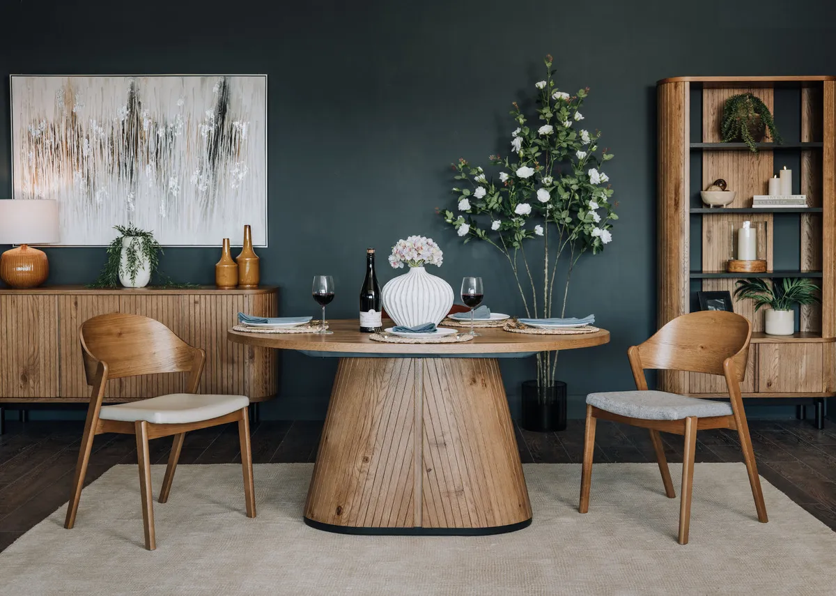 A lifestyle image of the vega dining table with matching dining chairs and sideboard with Tones of grey print.