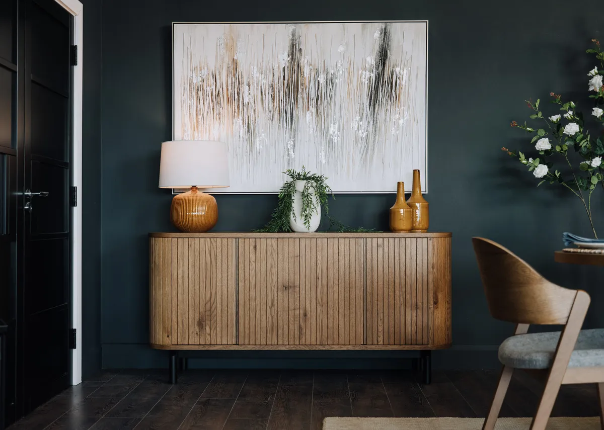A wide rustic oak sideboard with panel finish from EZ Livings Vega range. Front view of doors open