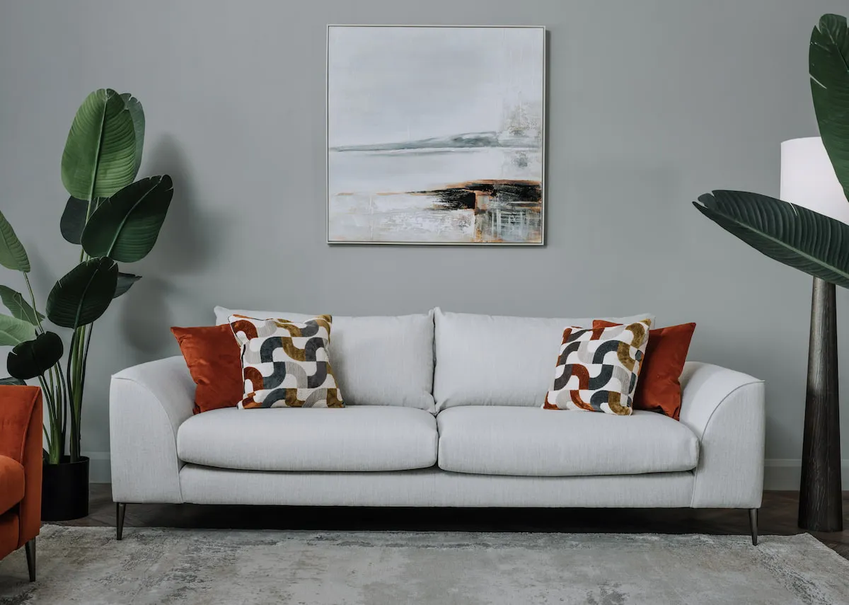 A lifestyle image of the Abbey 4 seater sofa with shorefront canvas