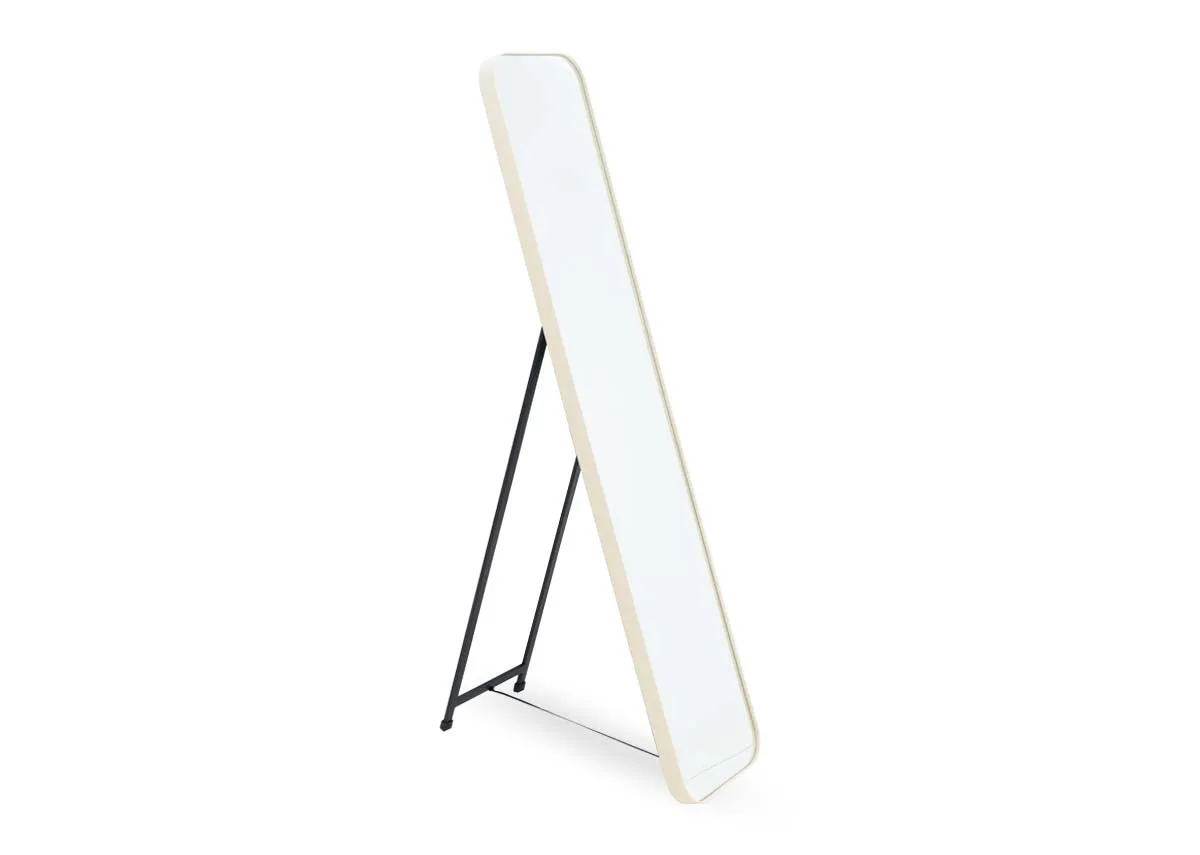 A cream rectangular free standing mirror from EZ Livings Taina range. Angled view of stand