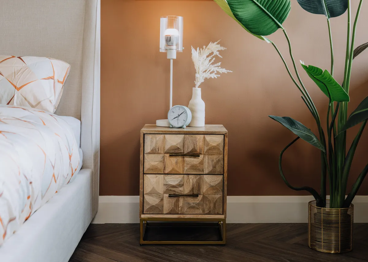 A lifestyle image of the Diva locker with the Karina cream table lamp