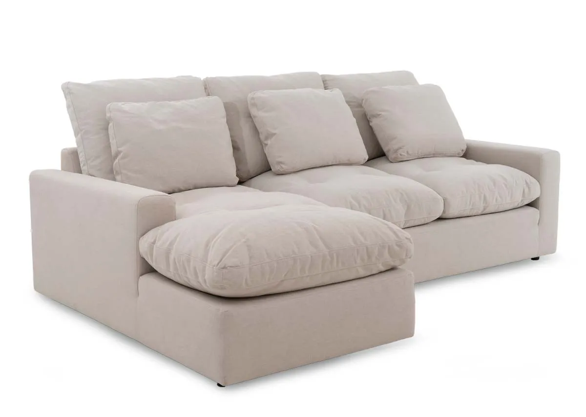 A 3 seater beige chaise from EZ Livings Cozy range. Angled view.