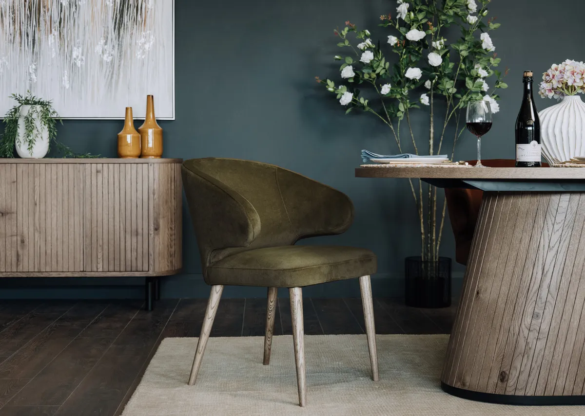 A lifestyle image of the Victor dining chair with grey vega table
