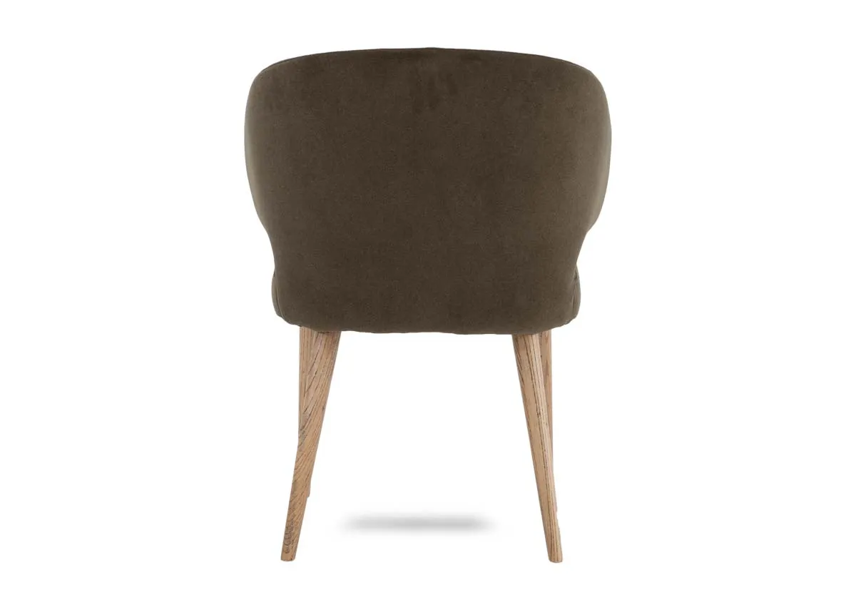 A green fabric dining chair from EZ Livings Victor range. Back view of curved seat and oak legs