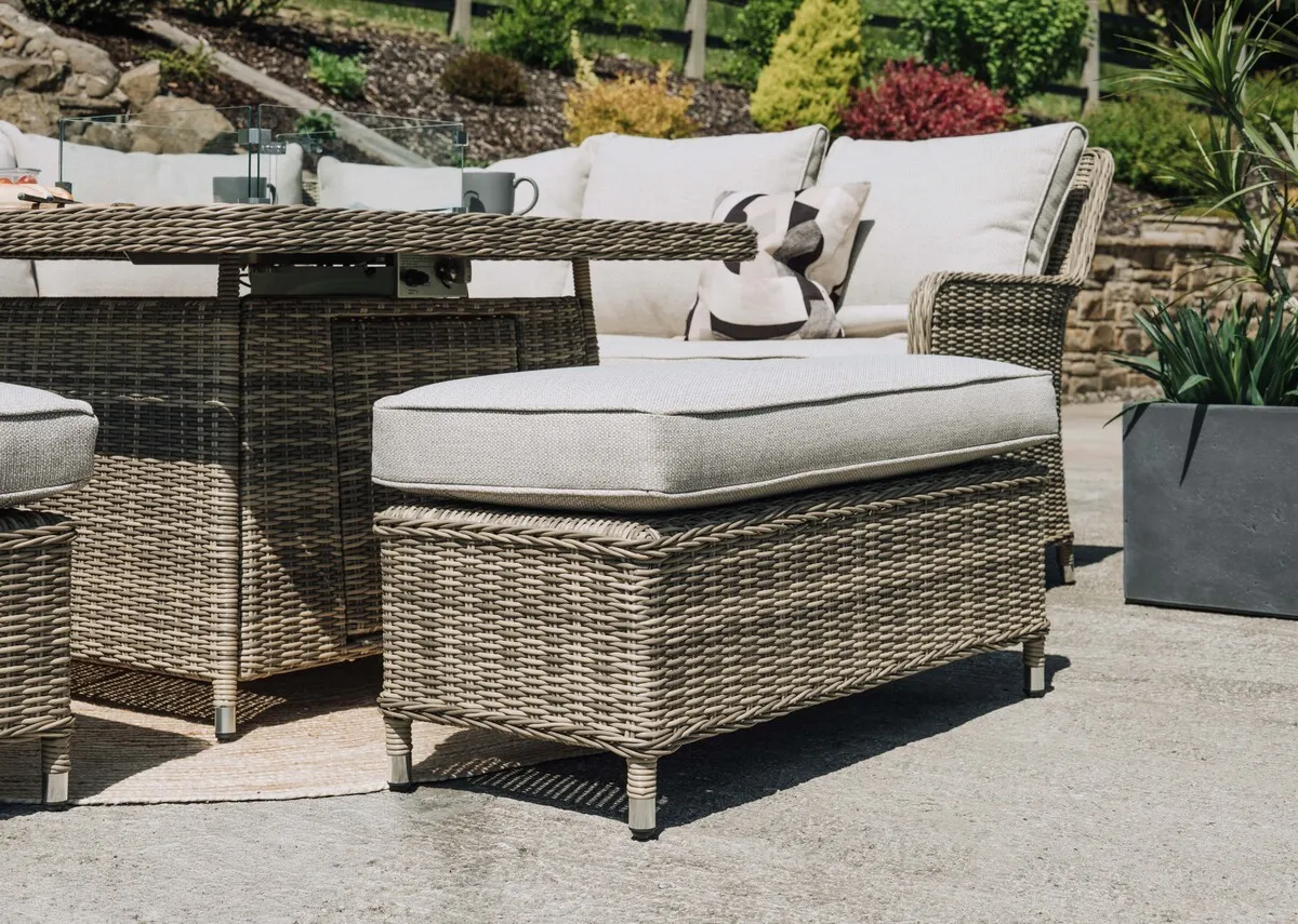 A grey corner woven garden set in 2 parts. Close up of Monterey and grey padded seat cushions.