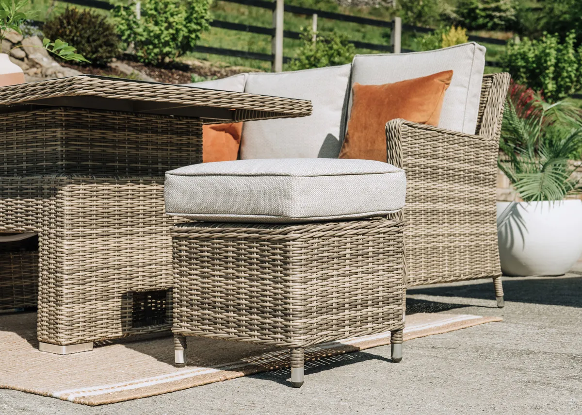 A grey woven stool with padded PE cushion from EZ Livings Monterey range. Angled view