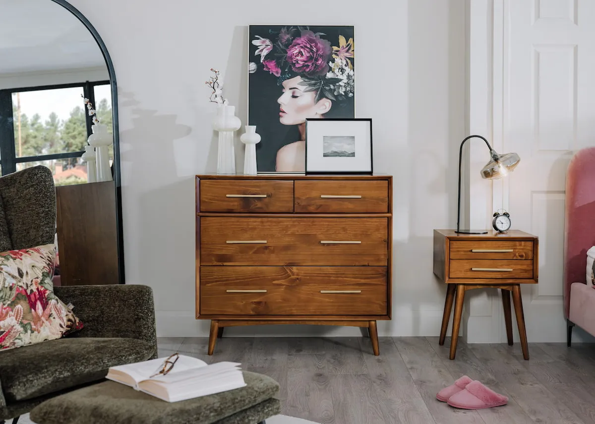 A lifestyle image of the Leya drawer chest with locker and the Lily canvas