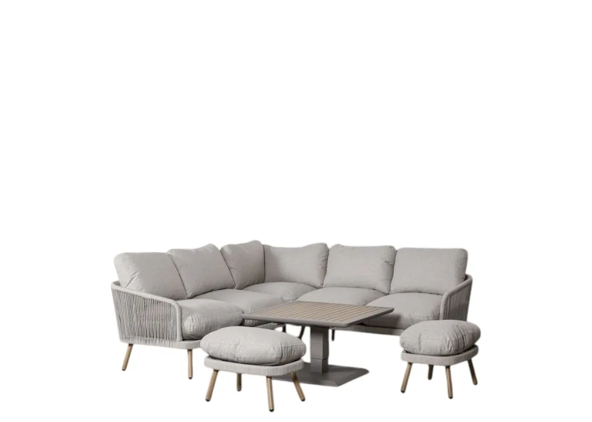 A corner garden set with 2 ottomans and square rising table. Angled view