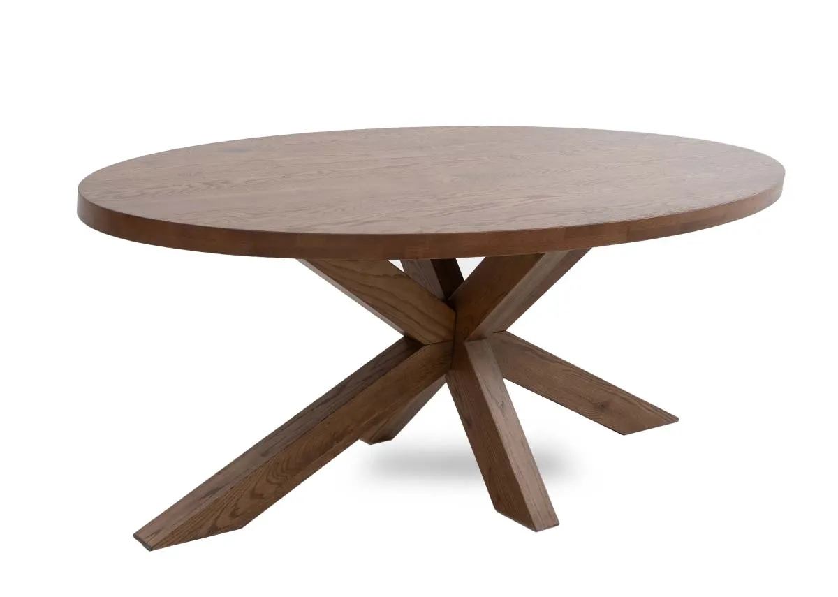 An oval solid oak dining table from EZ Livings Oslo range. Angled view of thick chunky worktop.