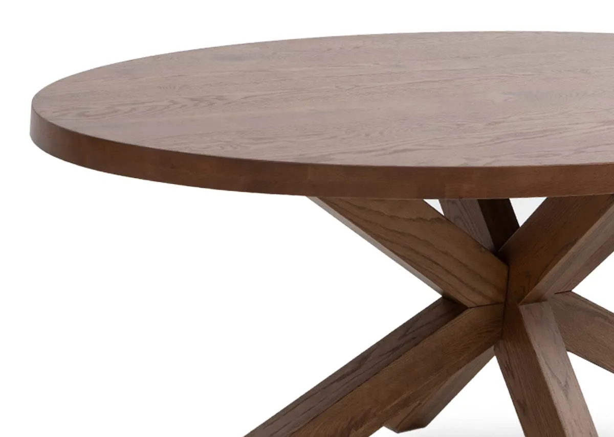An oval solid oak dining table from EZ Livings Oslo range. Closeup of wood texture