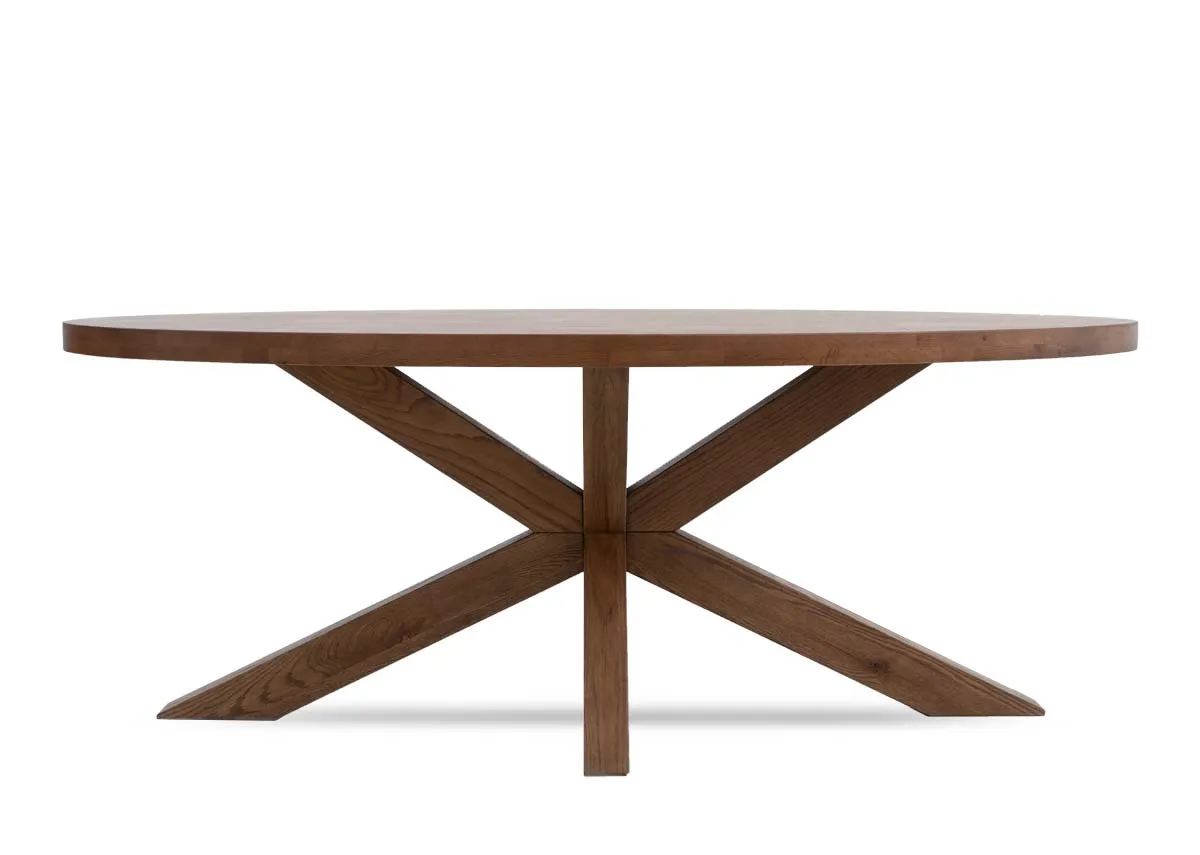 An oval solid oak dining table from EZ Livings Oslo range. Front view of x legs