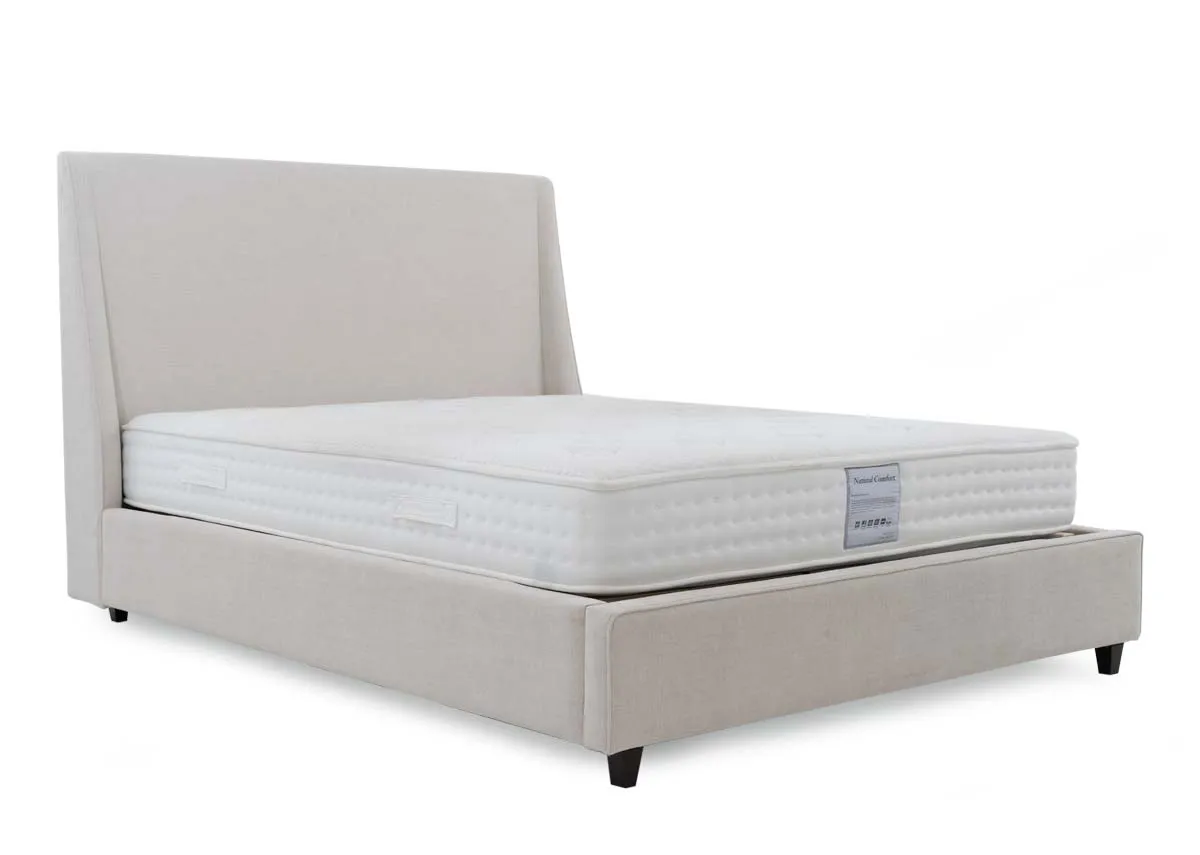 A beige fabric bed frame from EZ Livings Saoirse range. Angled view of bed with mattress not included.